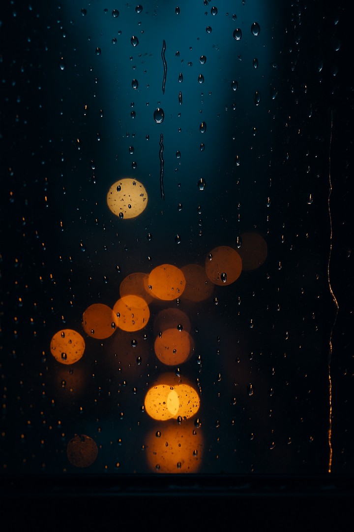 Rainy Night Reflections through the Window wallpaper