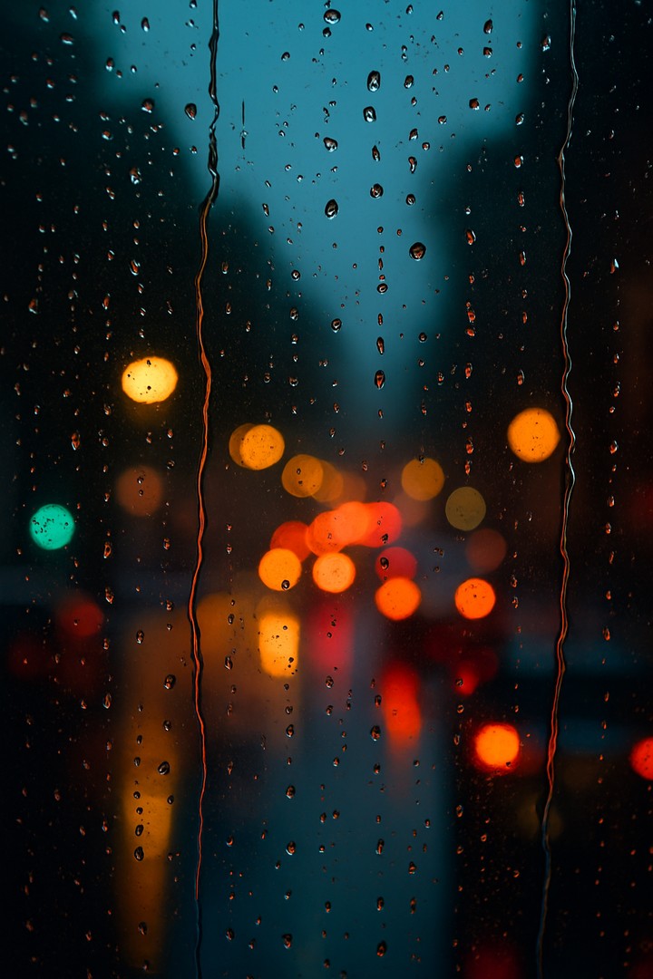Raindrops on Window Pane in Soft Evening Light