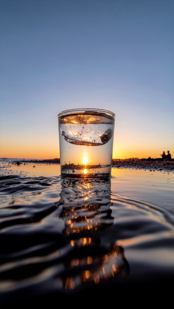Sunset Glass on Beach Wallpaper - Golden Hour Light Refraction 4K