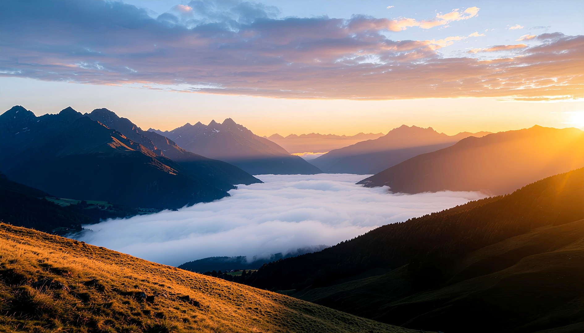 Golden Sunrise Over Mountain Valley and Clouds Wallpaper