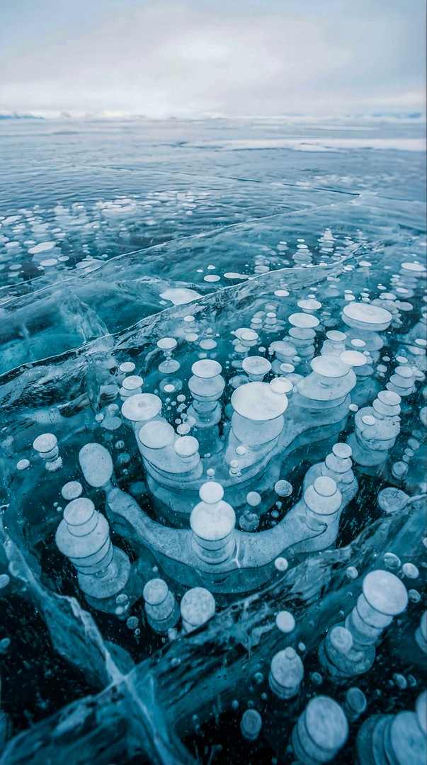 Frozen Lake with Ice Bubbles Pattern 4K Wallpaper