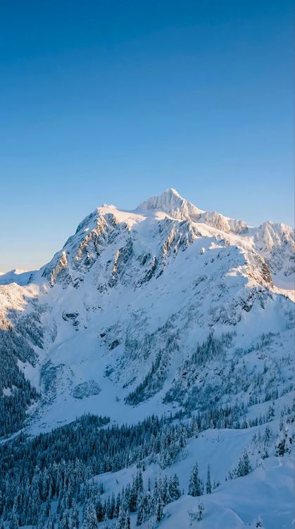 Majestic Snow Mountain Peak Blue Sky 4K Wallpaper